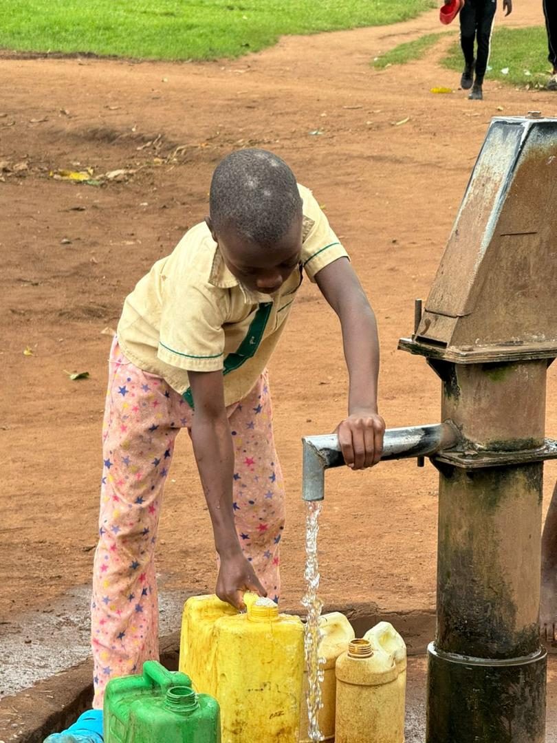 A community gathering at a clean water borehole
