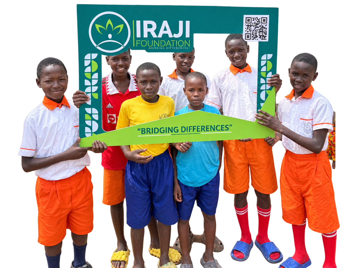 Six children holding an Iraji Foundation frame reading Bridging Differences